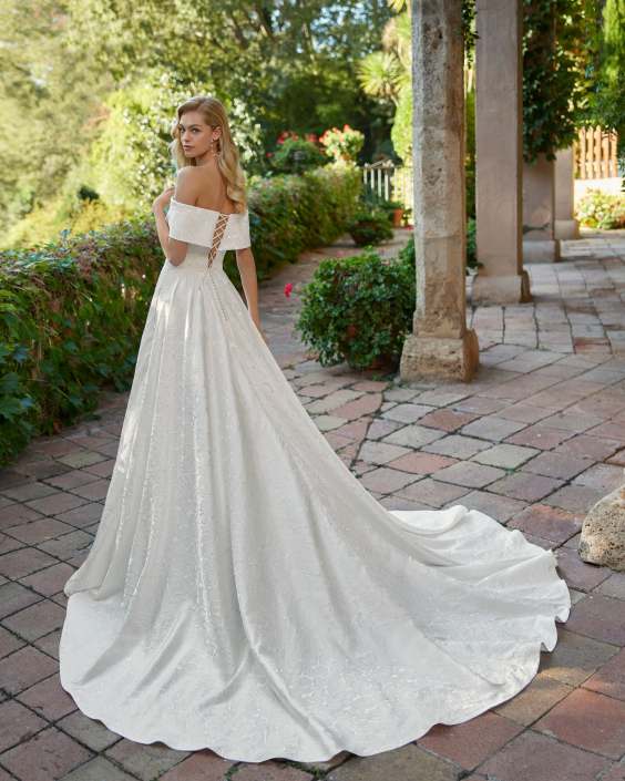 Dolmer – From £1310 Dolmer – From £1310 Zip back or corset. Available in Satin, Verona Mikado, and Brocade.
